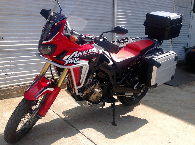 A red Honda® Africa Twin dual sport motorcycle.